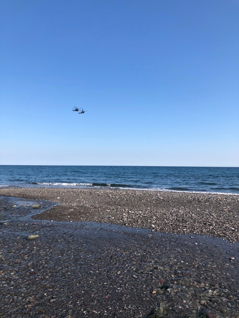 military helicopters flying over seaton beach cornwall