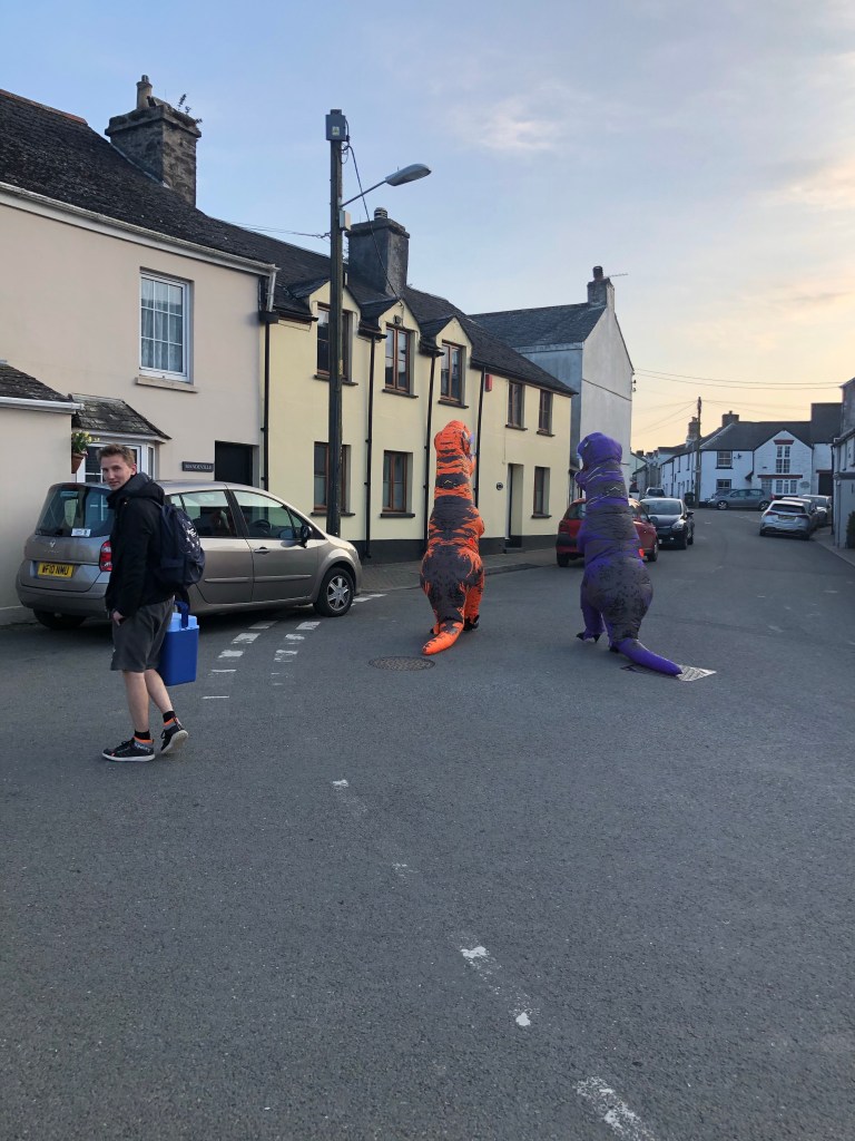 dinosaur fancy dress in the street landrake cornwall