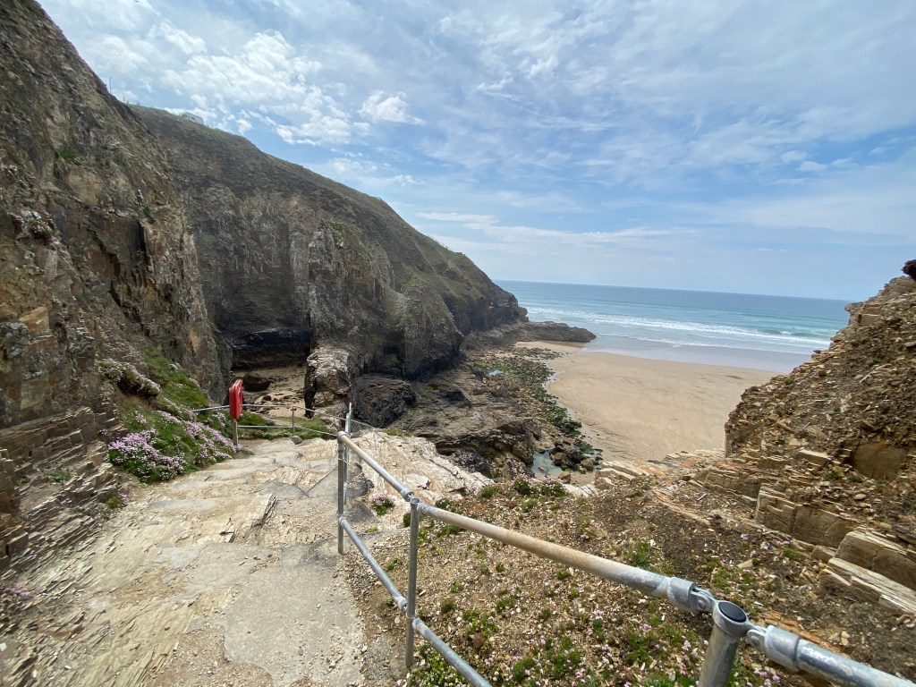Cliff steps down to Perranporth beach in Cornwall