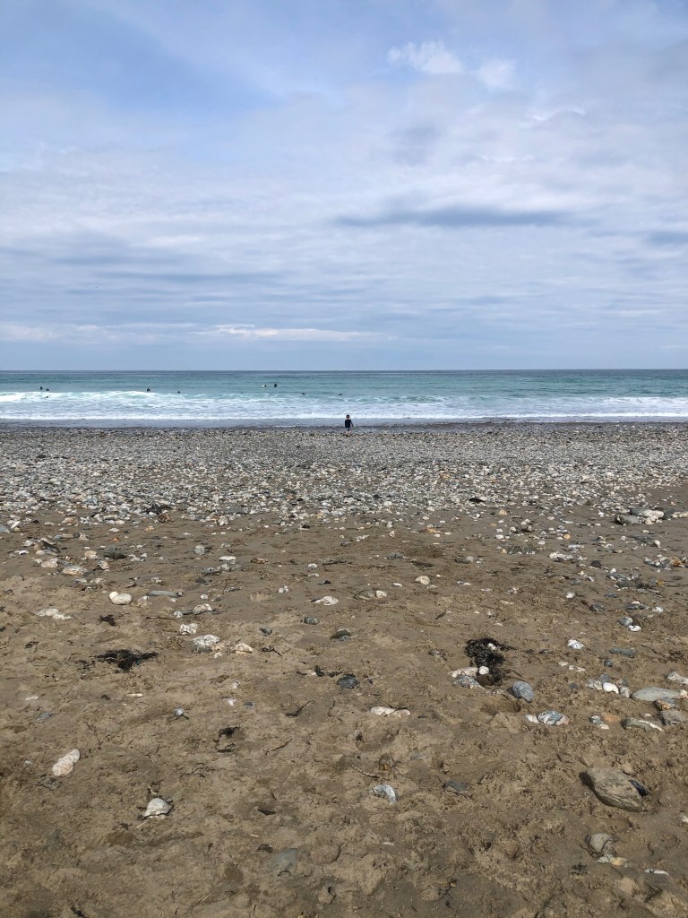 Reuben, our 6 year old, in the distance heading to the sea and waves at Porthtowan beach