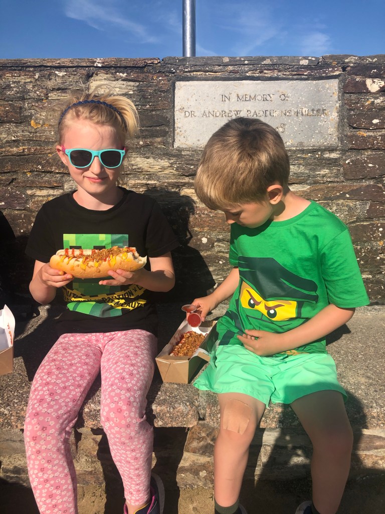 Eating vegan hotdogs in Perranporth