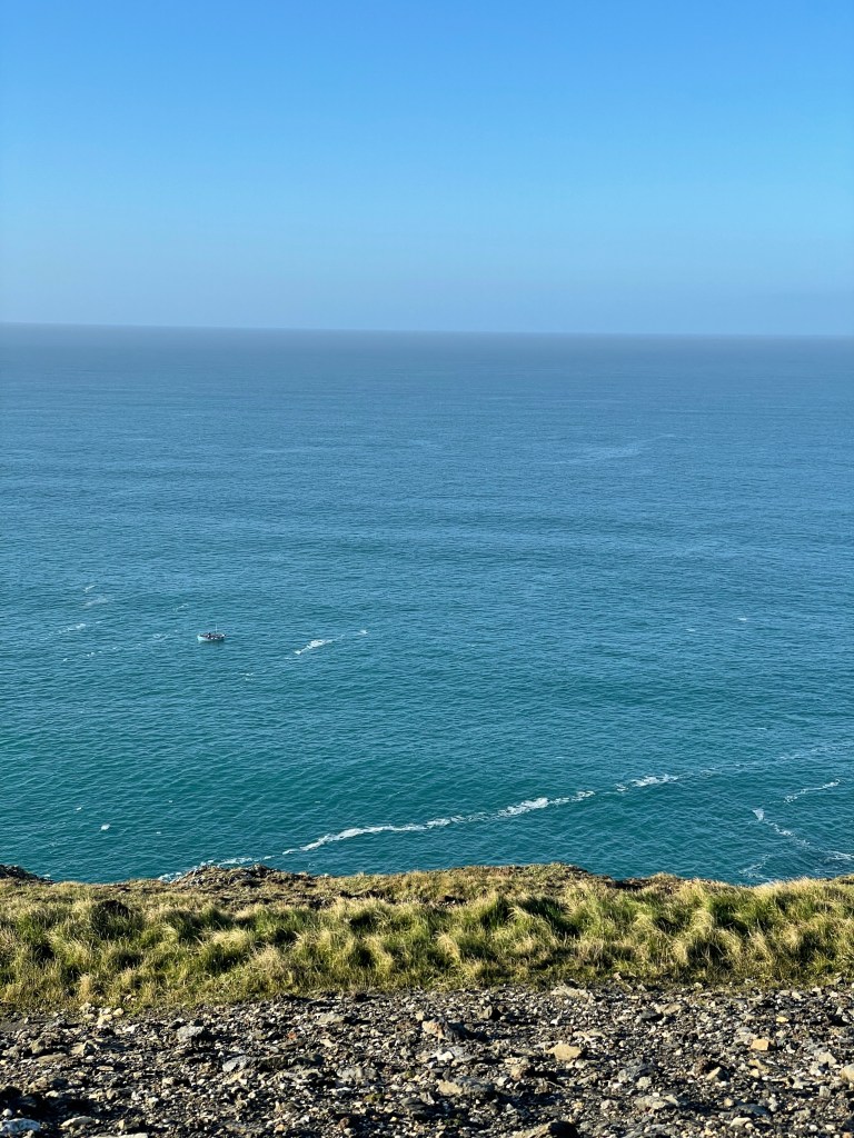 lone boat in the atlantic ocean