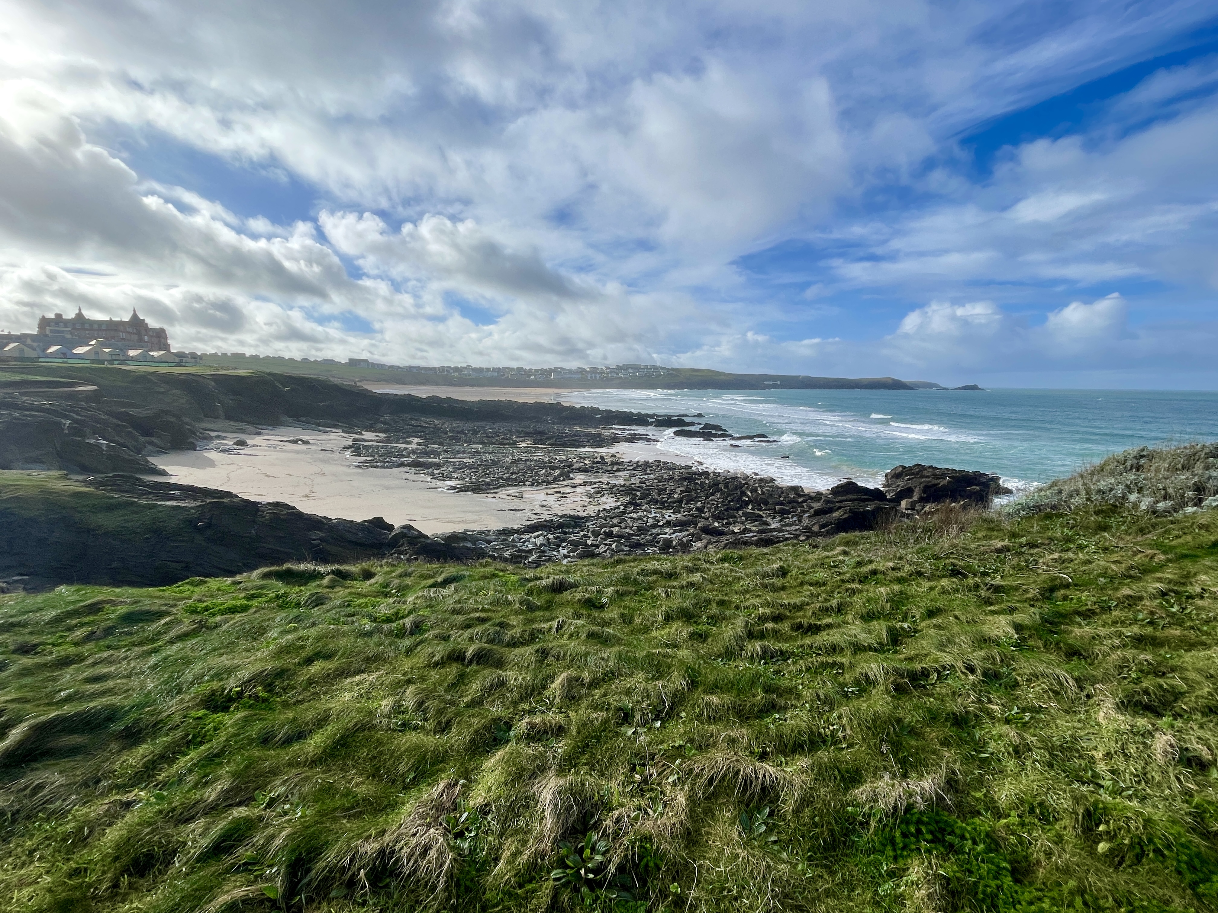 Little Fistral Beach Newquay with Fistral BEach and the iconic Headland Hotel in the distance 