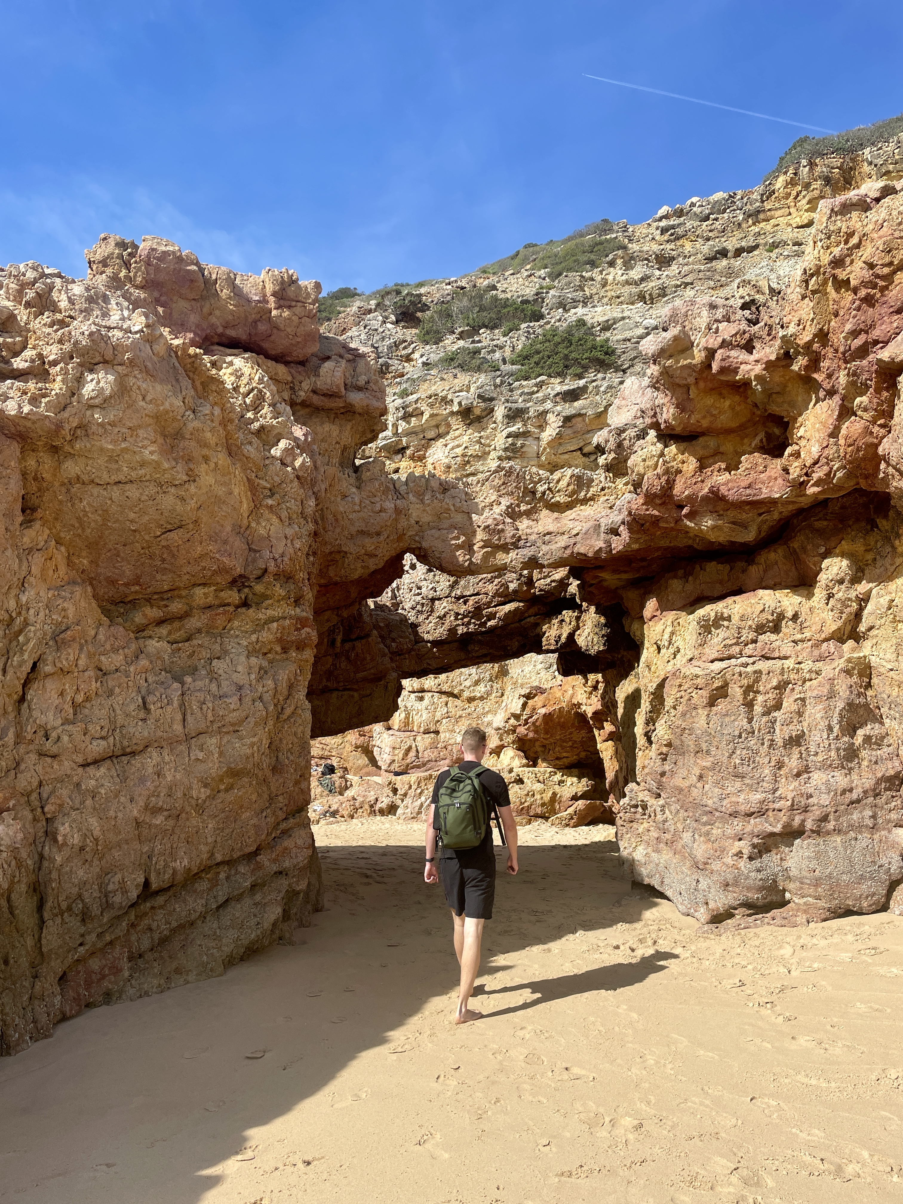 Accessing Praia das Furnas through incredible rock formations at low tide from Praia da Andorinha.