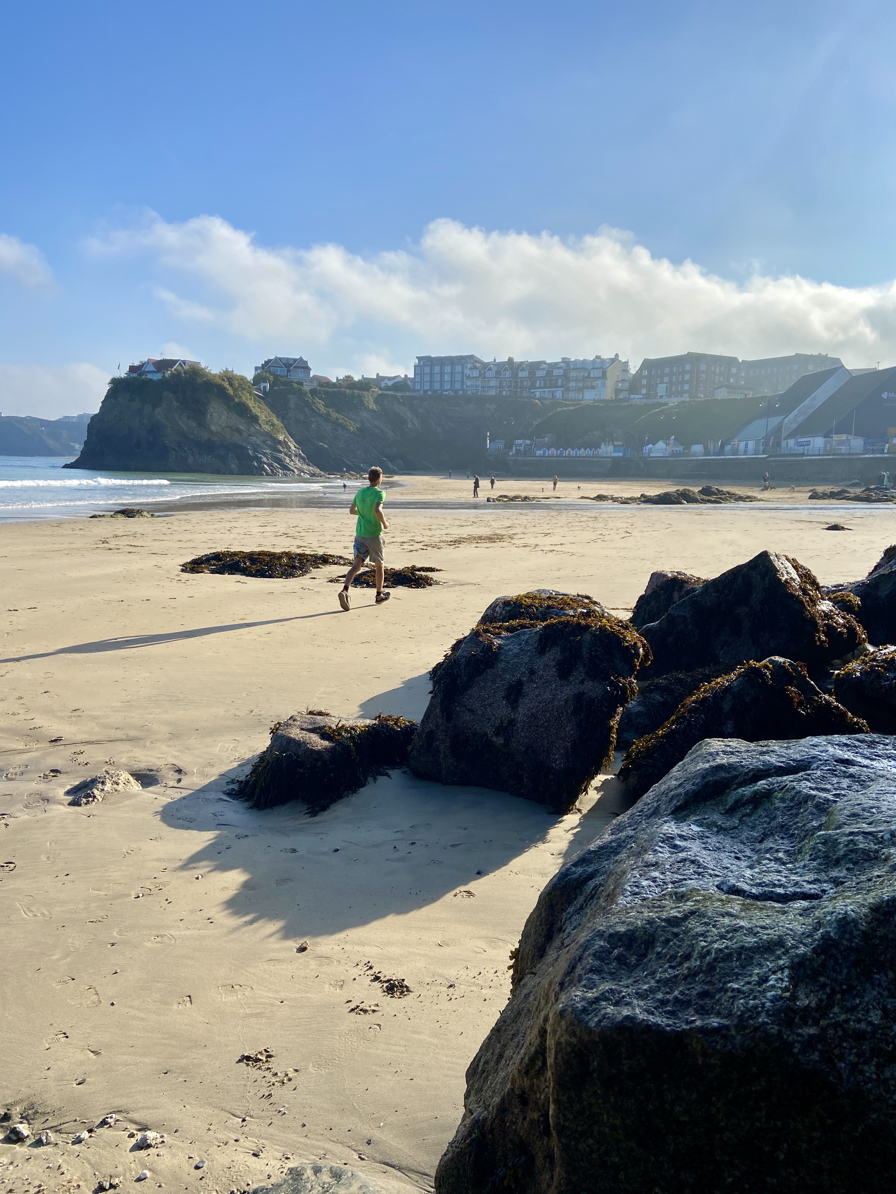 Cutting across Towan Beach on a morning jog