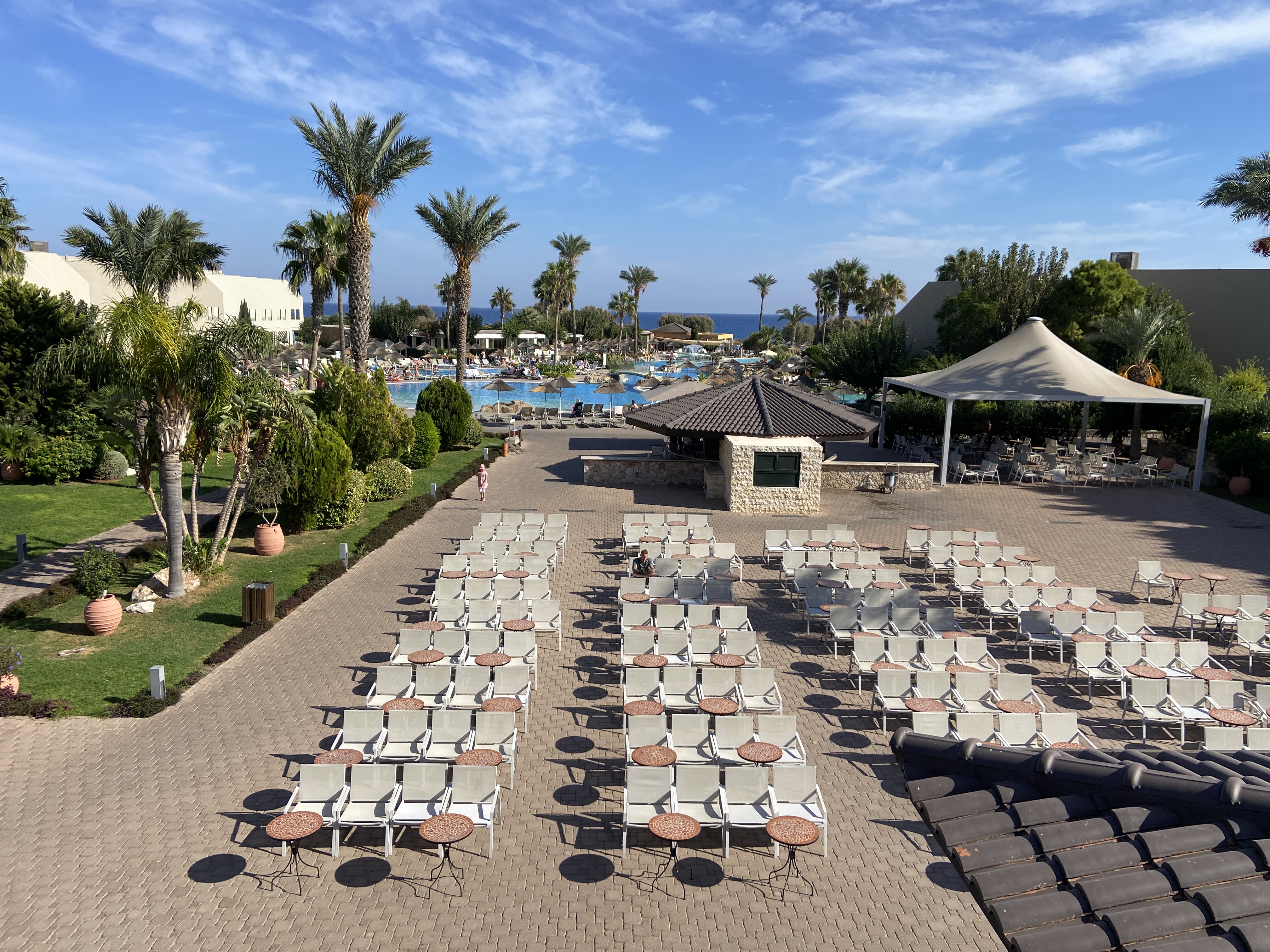 Evening entertainment tables and chairs at Atlantica Aegean Blue