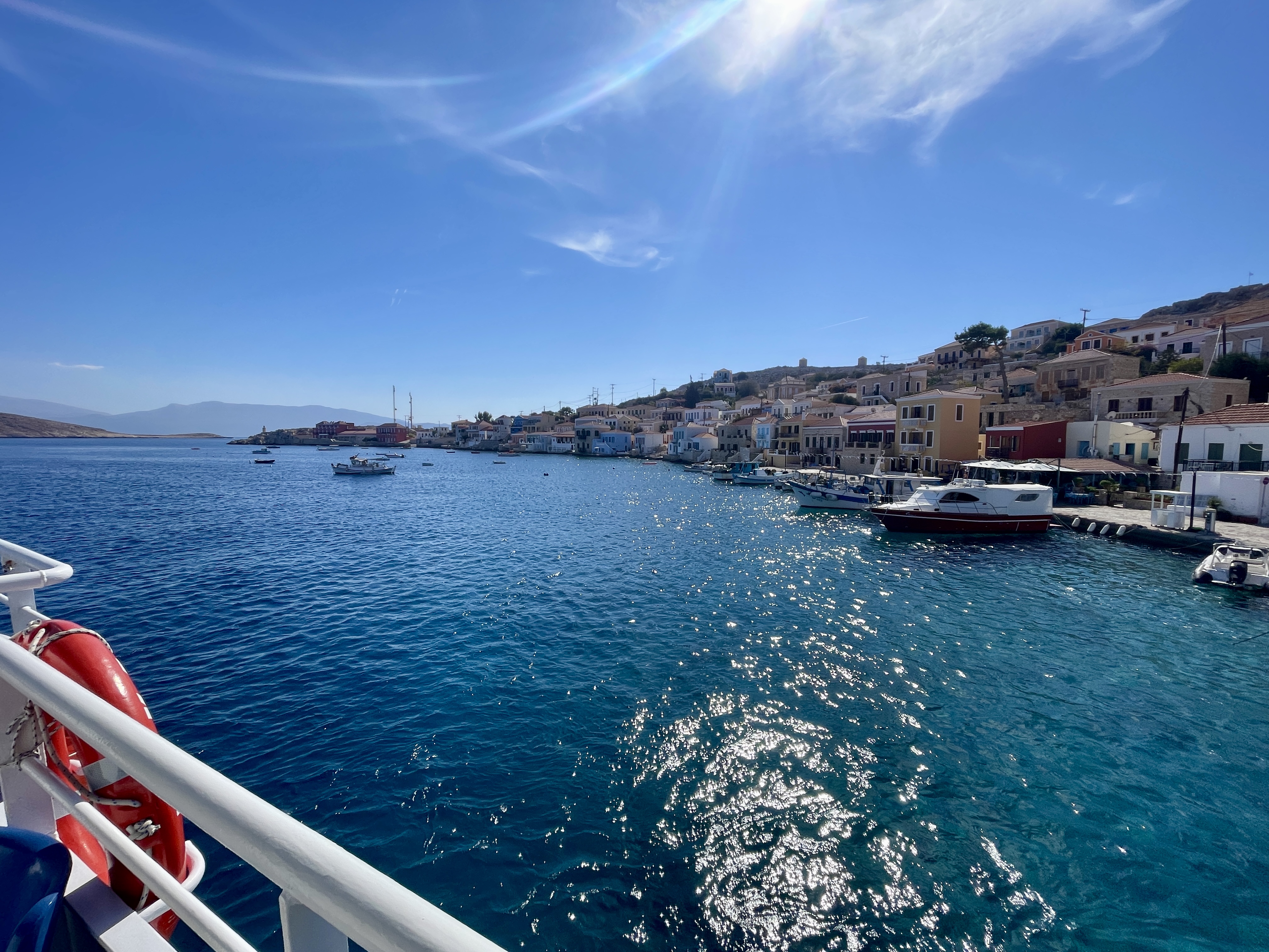 arriving by boat to chalki island in greece