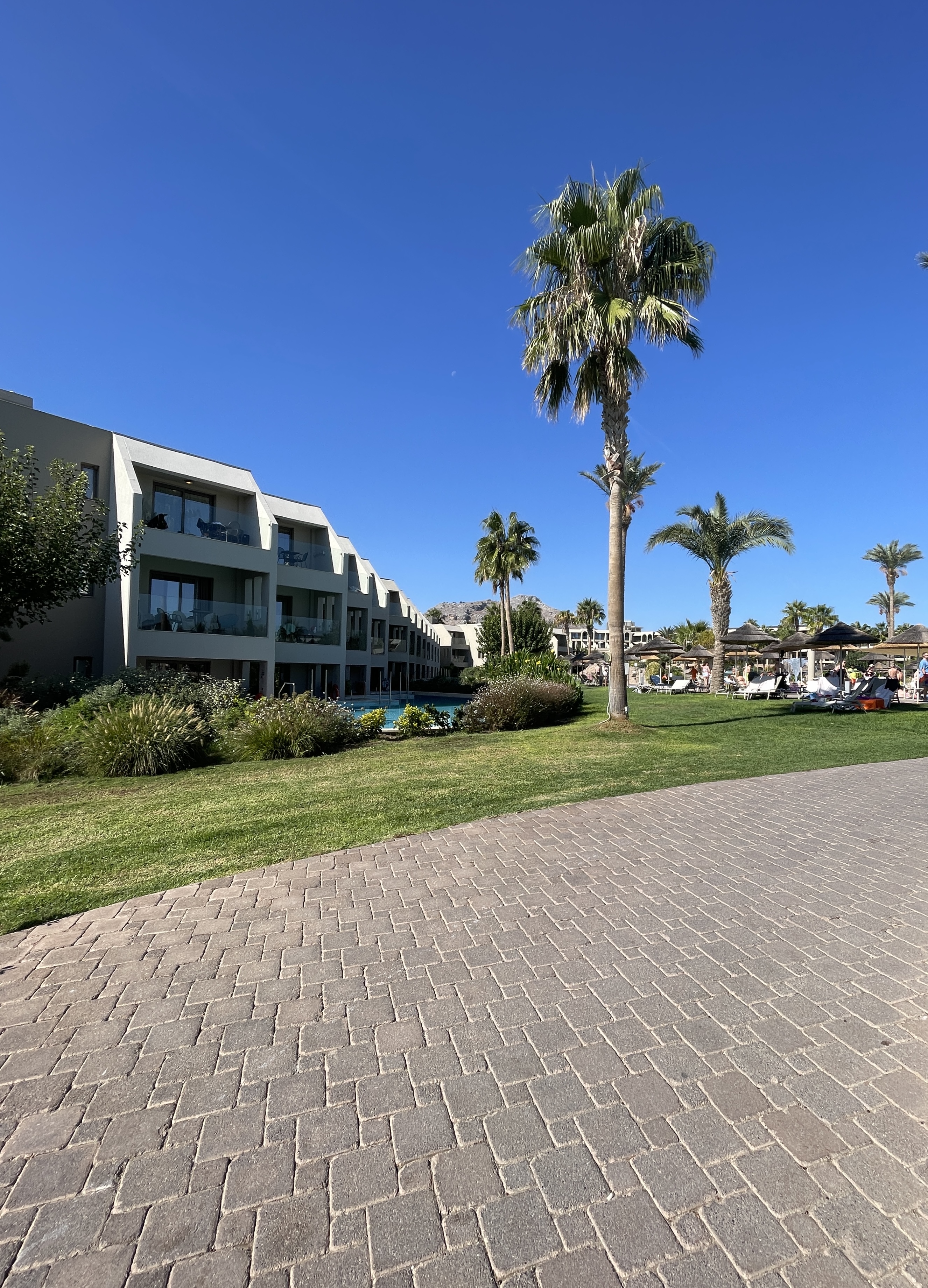 Grounds and types of accommodation buildings at atlantica aegean blue hotel in Kolymbia in rhodes greece