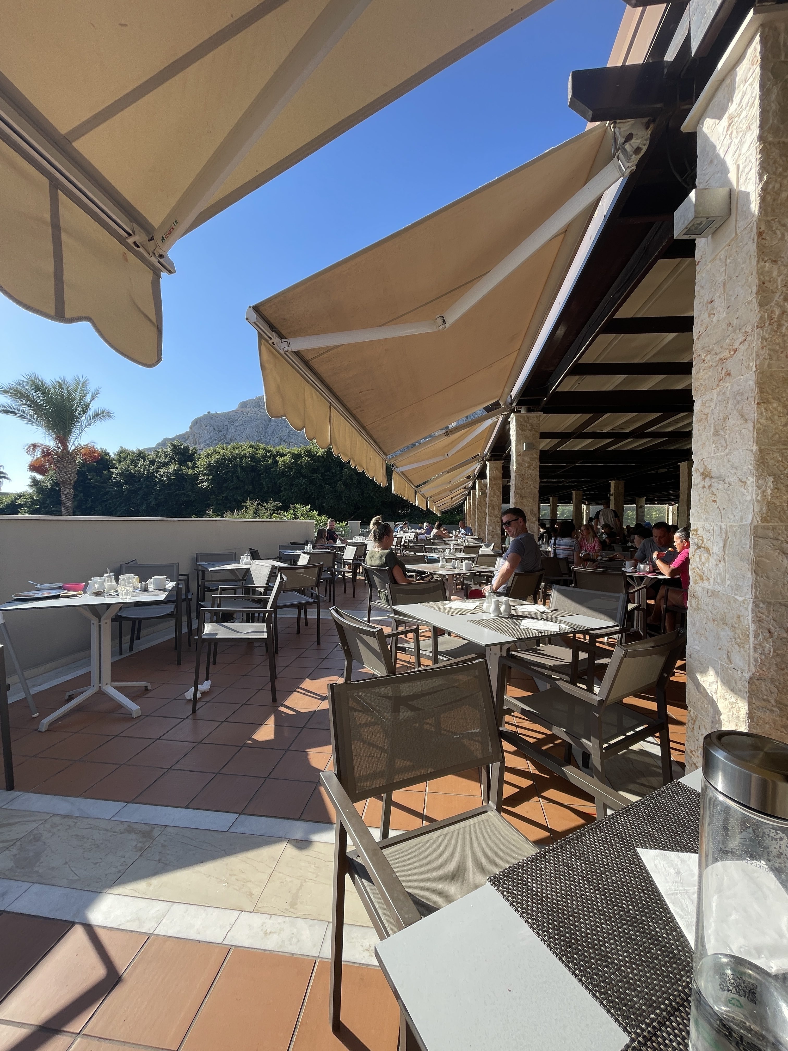 Outside sunny seating at the atlantica aegean blue hotel in rhodes