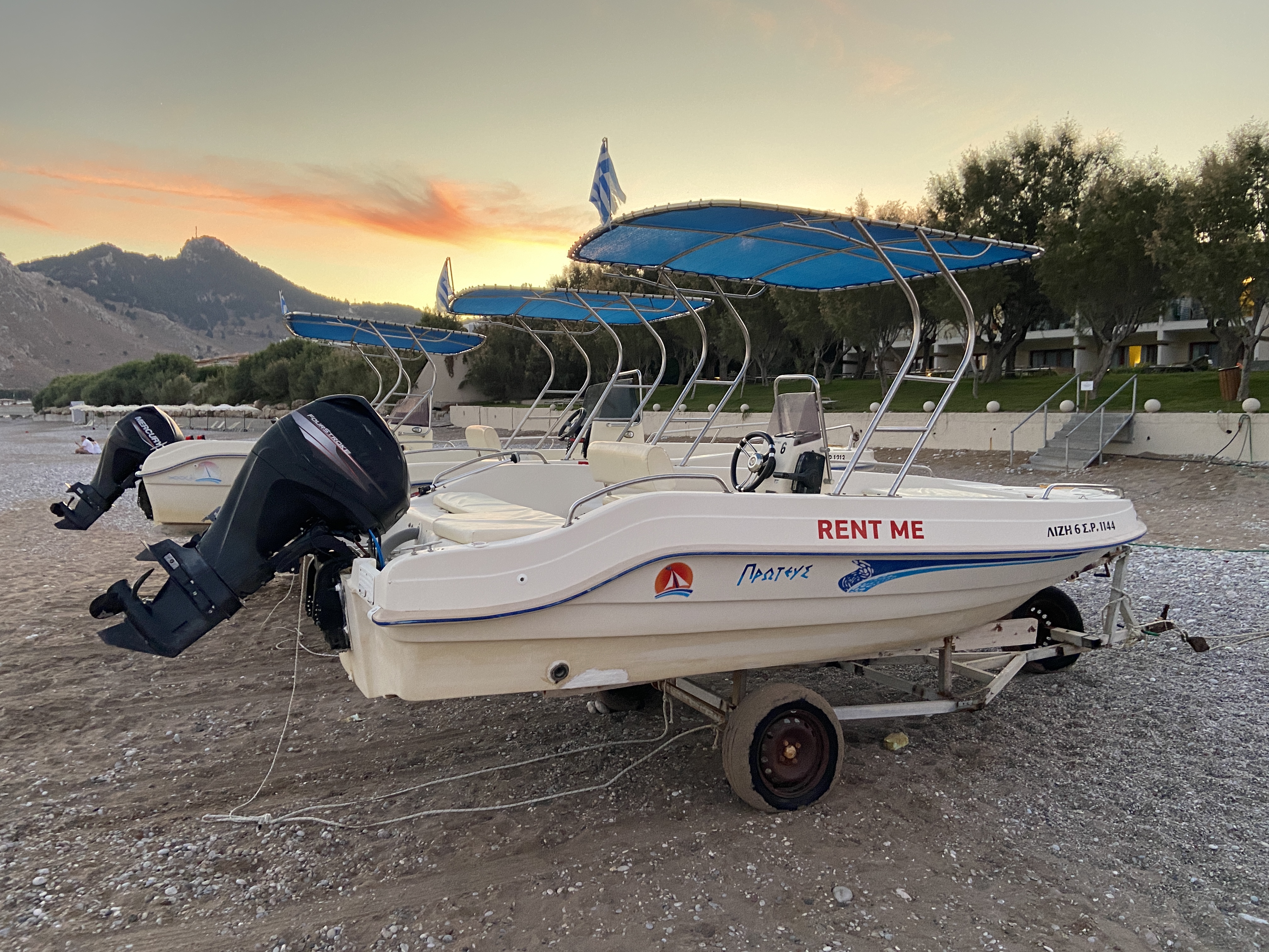 Boat hire on Kolimbia beach outside of the atlantica aegean blue hotel