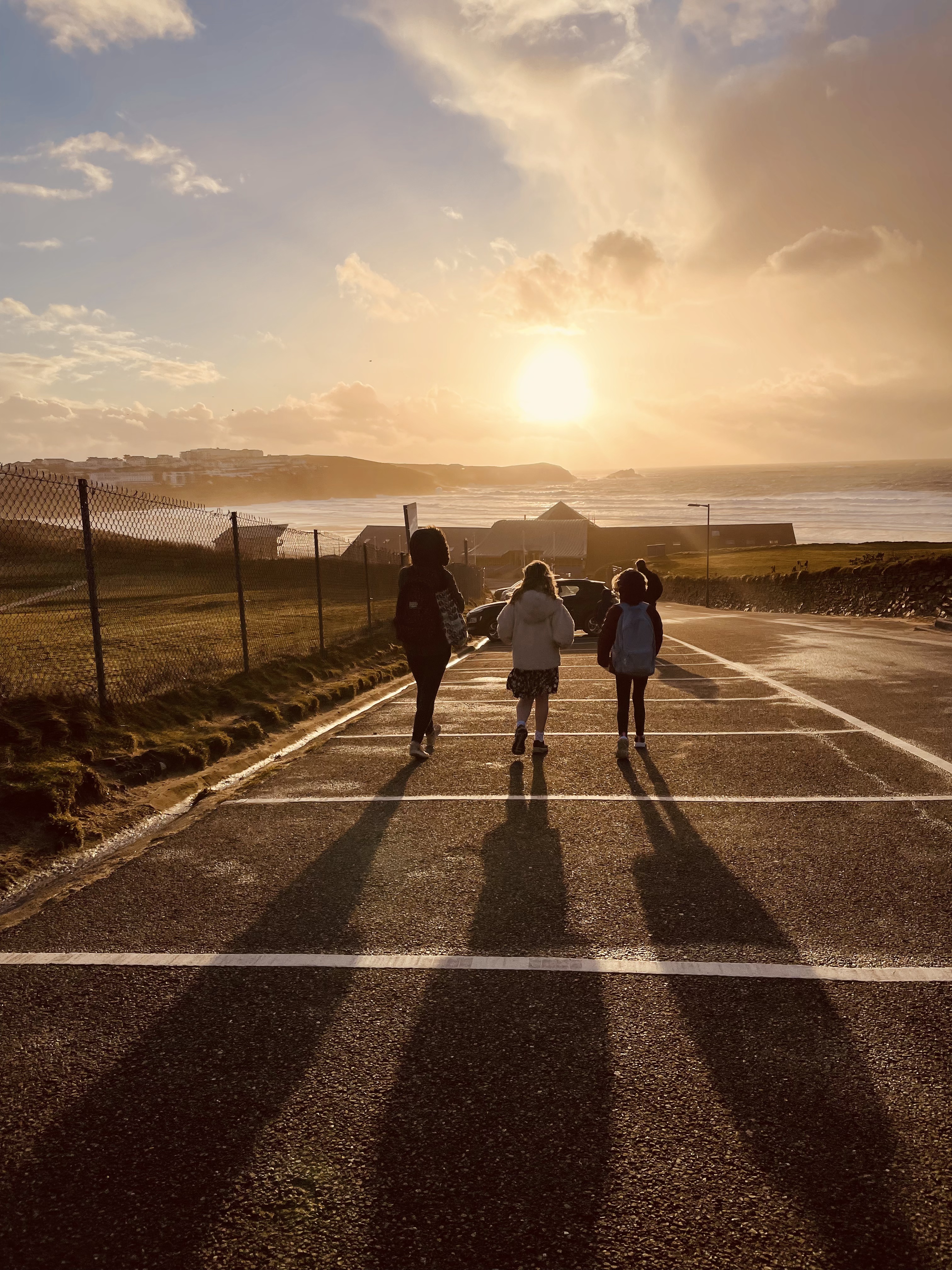 Walking towards Fistral Beach across the carpark as the sun begins to set