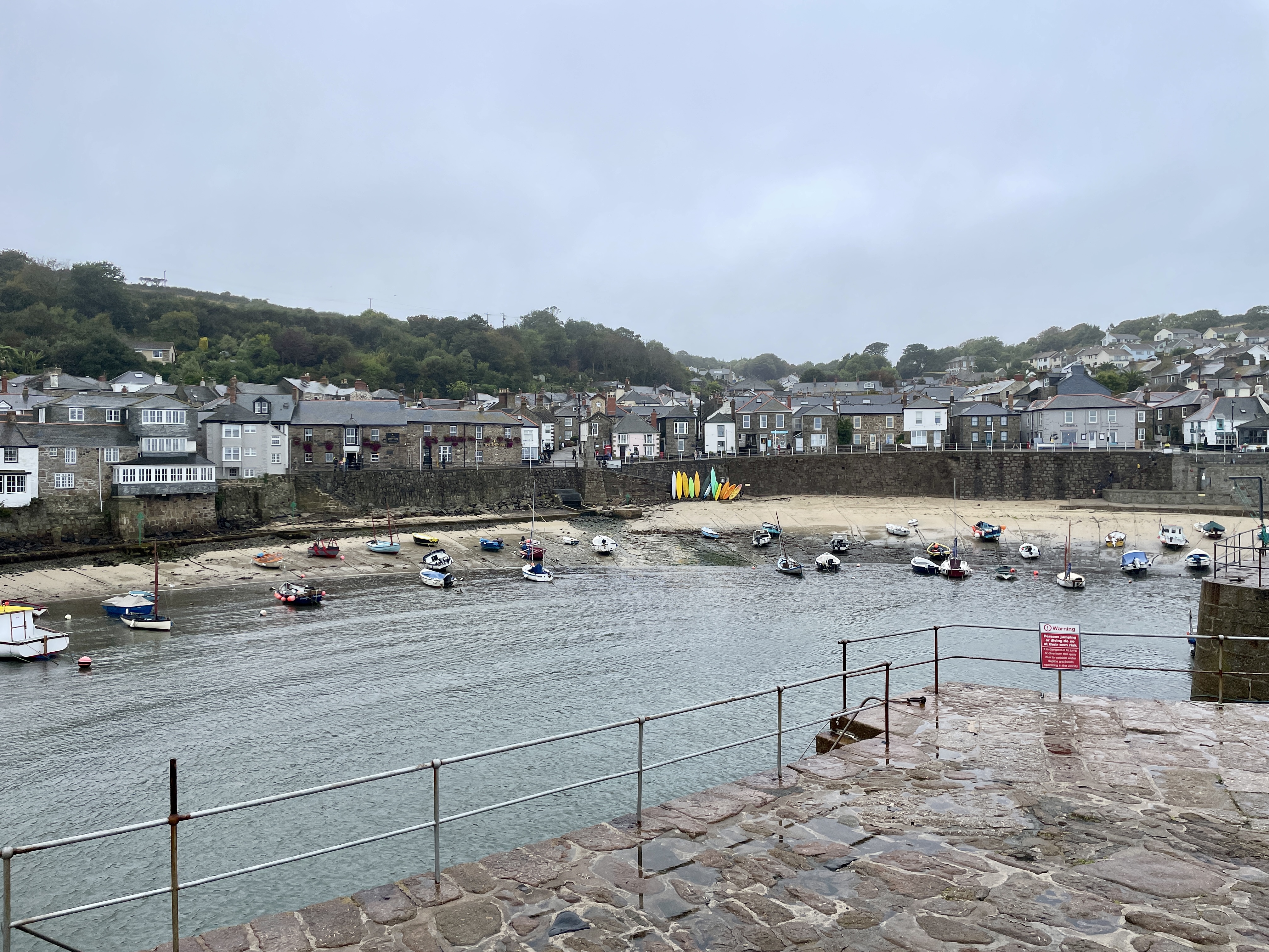 Boats at low tide in Mousehole harbour