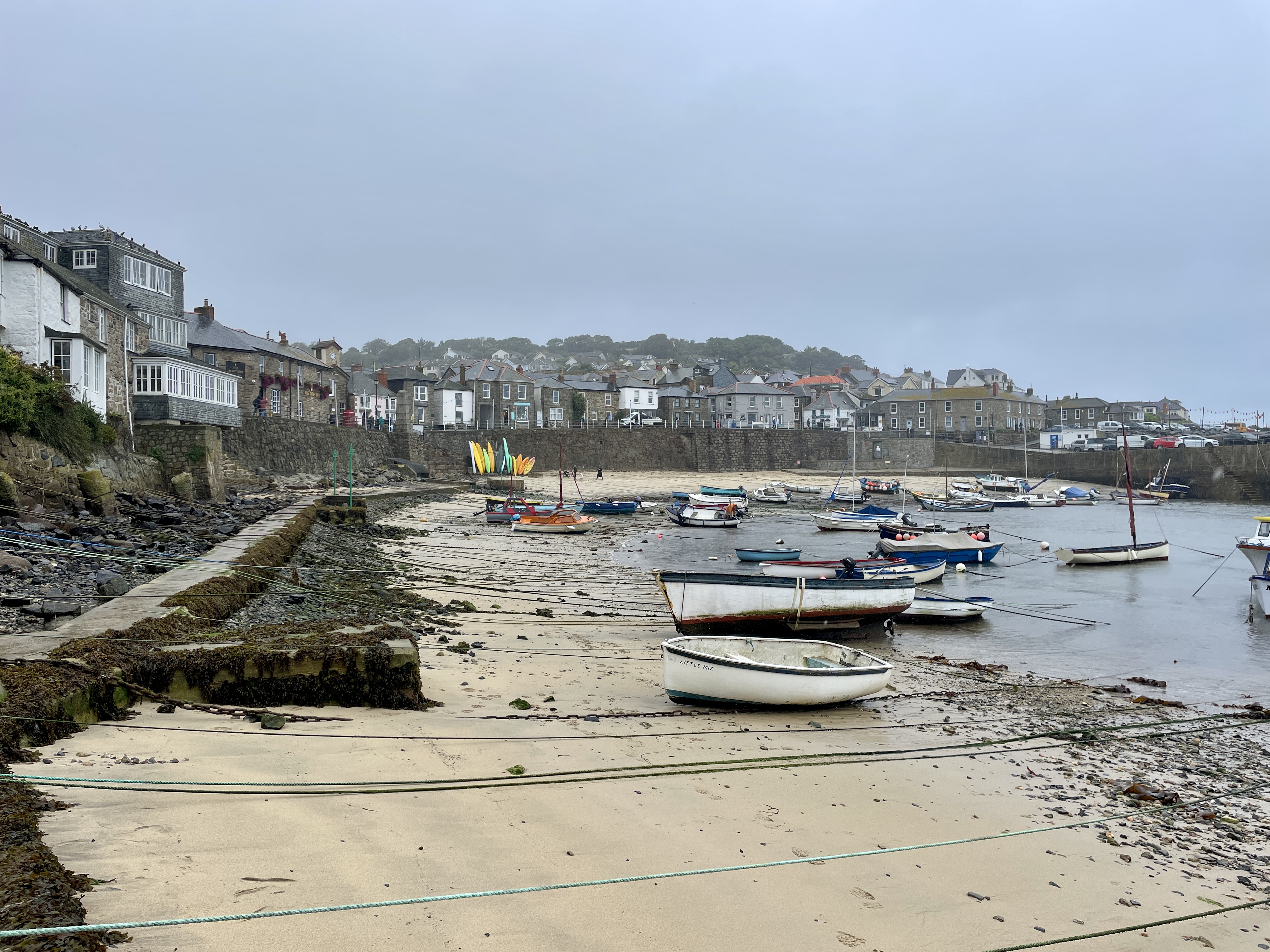 Boats at low tide in Mousehole harbour