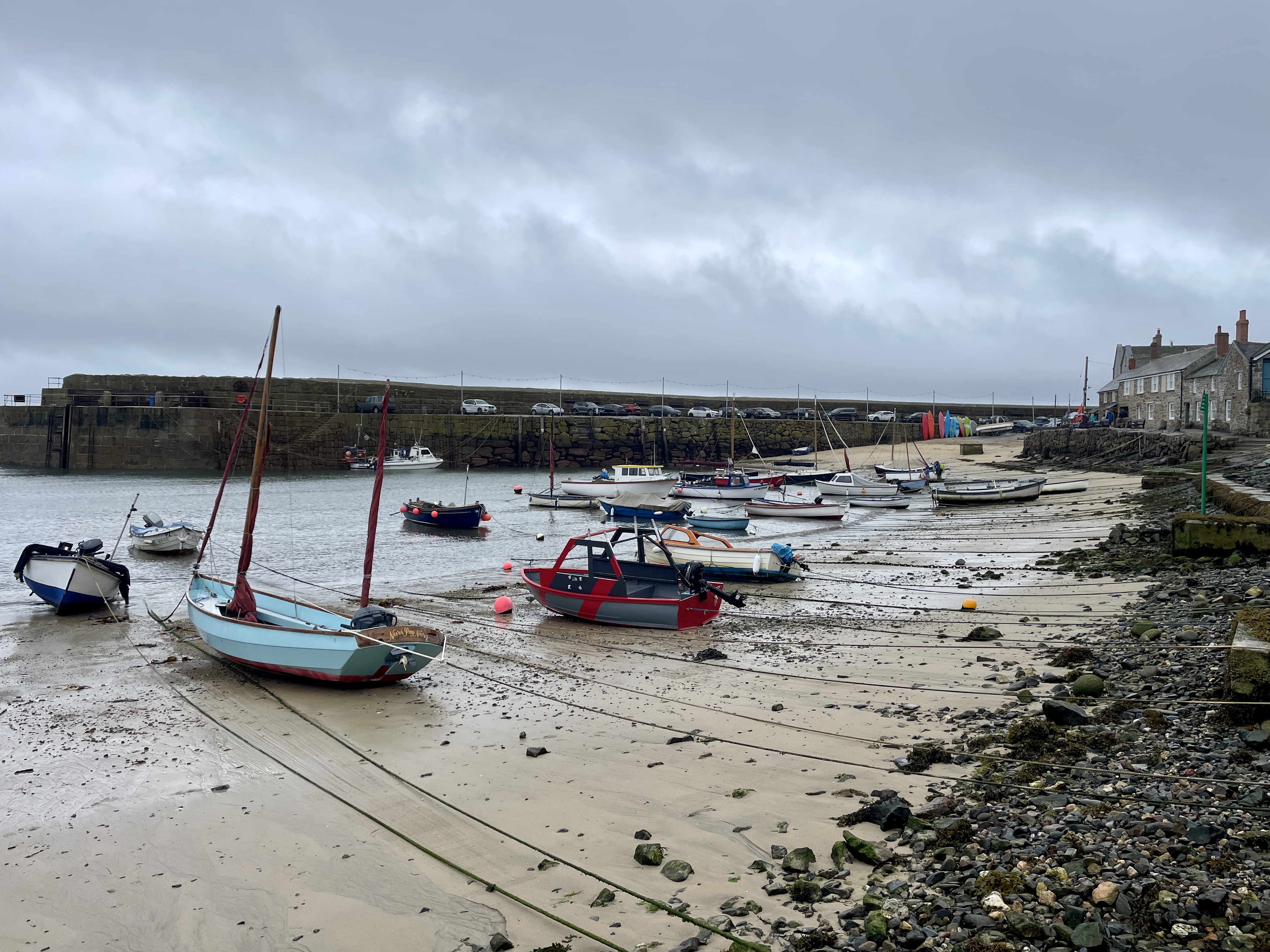 Boats at low tide in Mousehole harbour