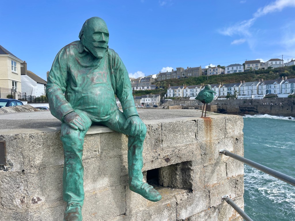 "Waiting For Fish" a bronze sculpture by Holly Bendall in Porthleven
