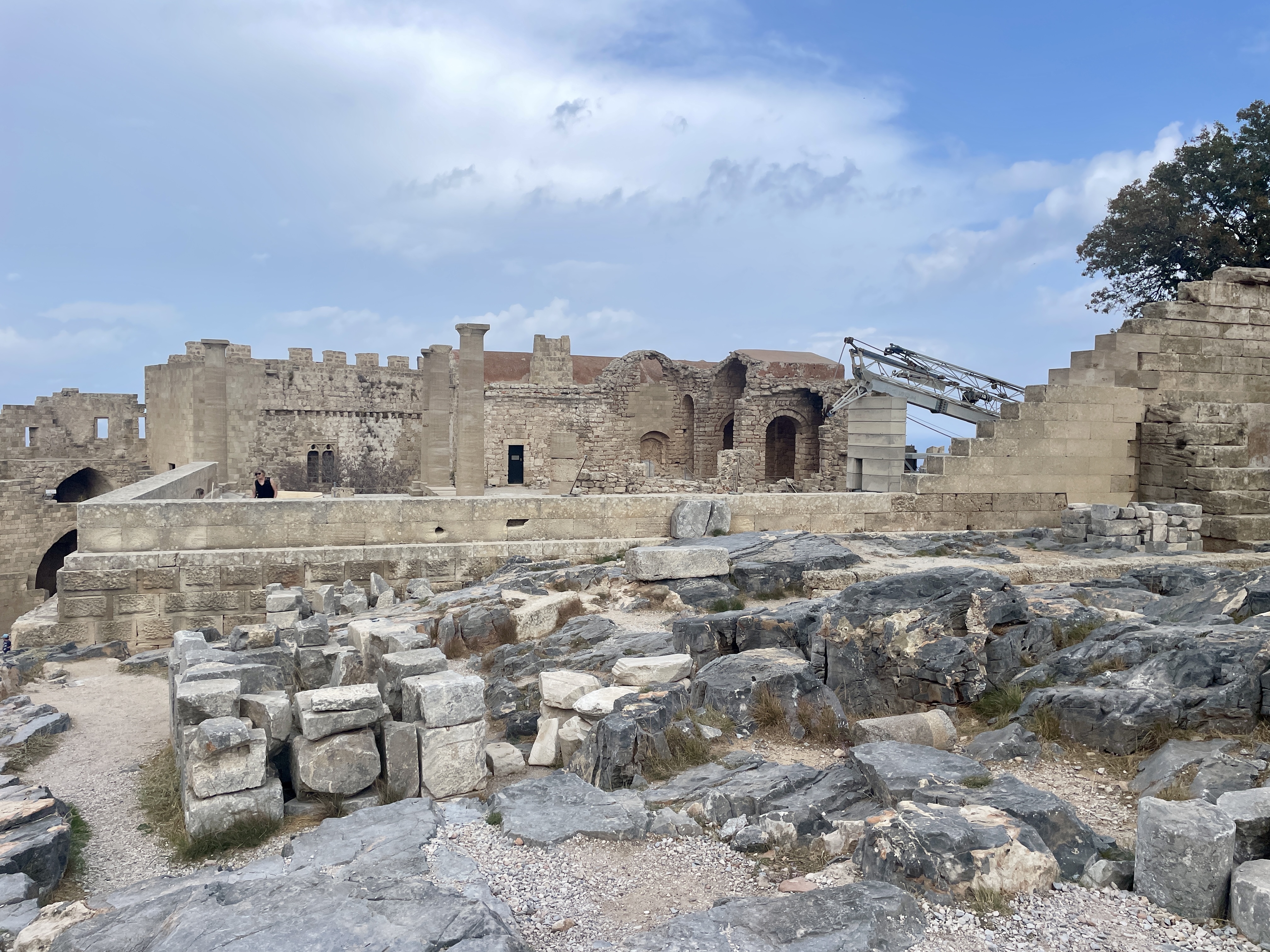 Ongoing archaeological conservation at Lindos Acropolis, where teams continue careful restoration of ancient ruins.