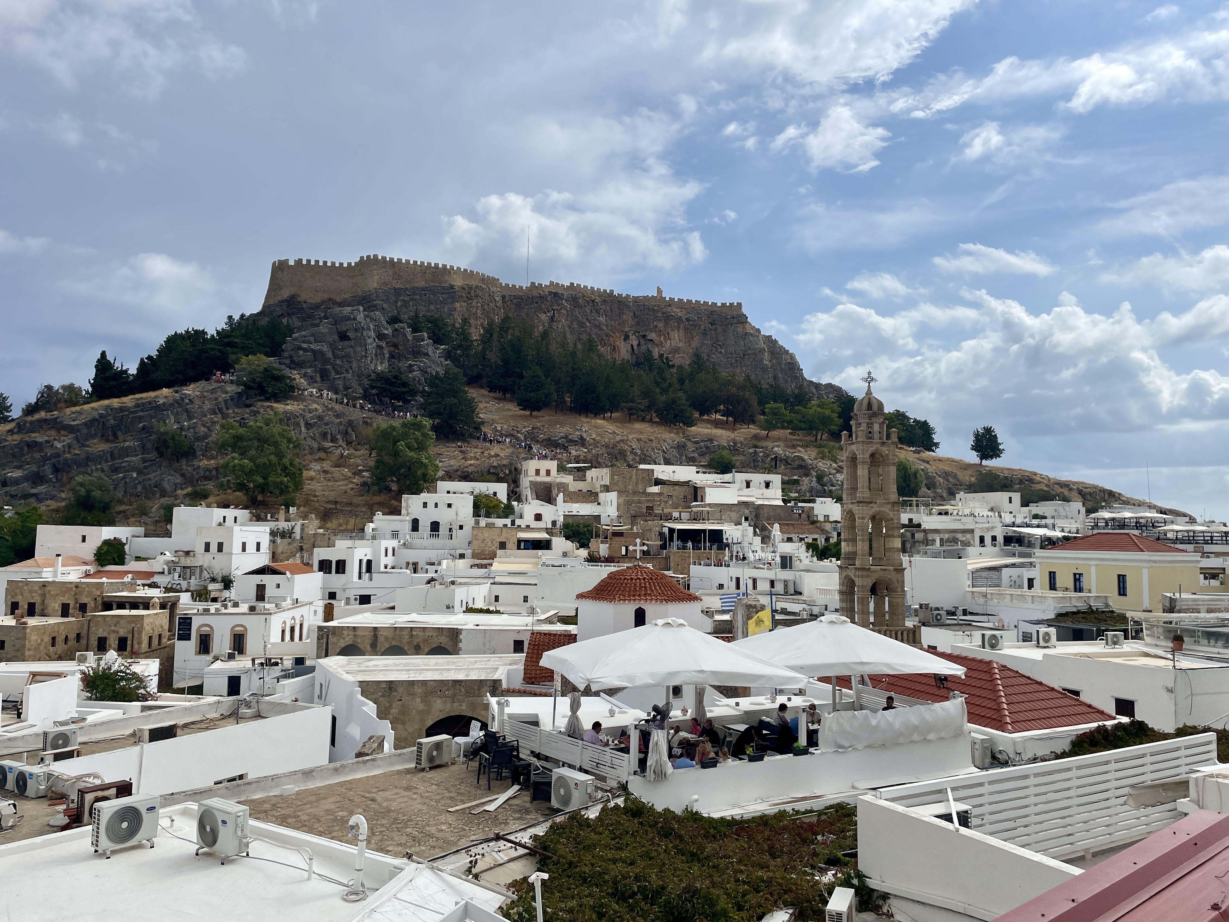 Amazing views of the Lindos Acropolis from the rooftop terrace at T-Veg vegan restaurant in Rhodes