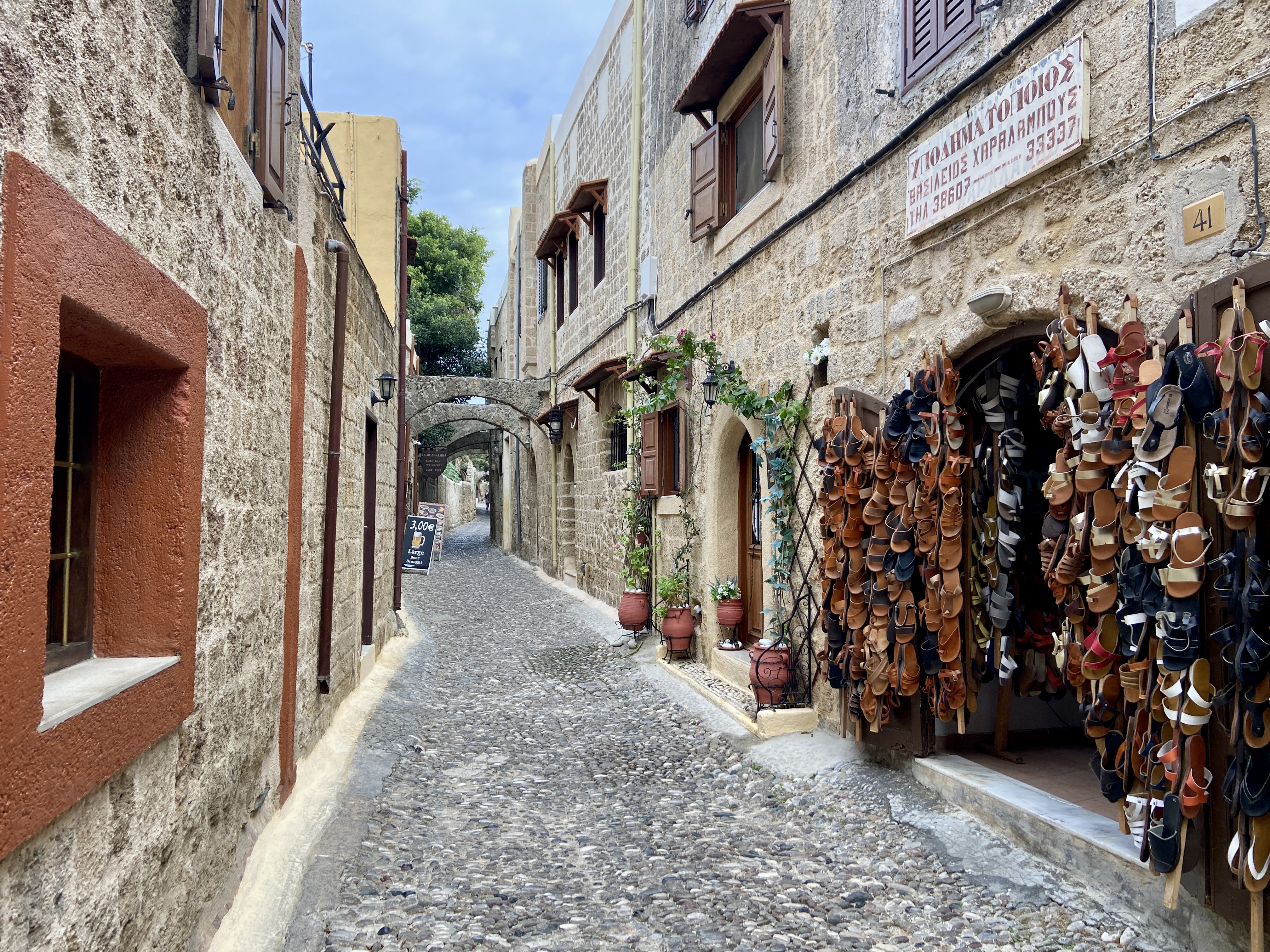 Discover shops, pubs and restaurants down cobbled streets in Rhodes Old Town
