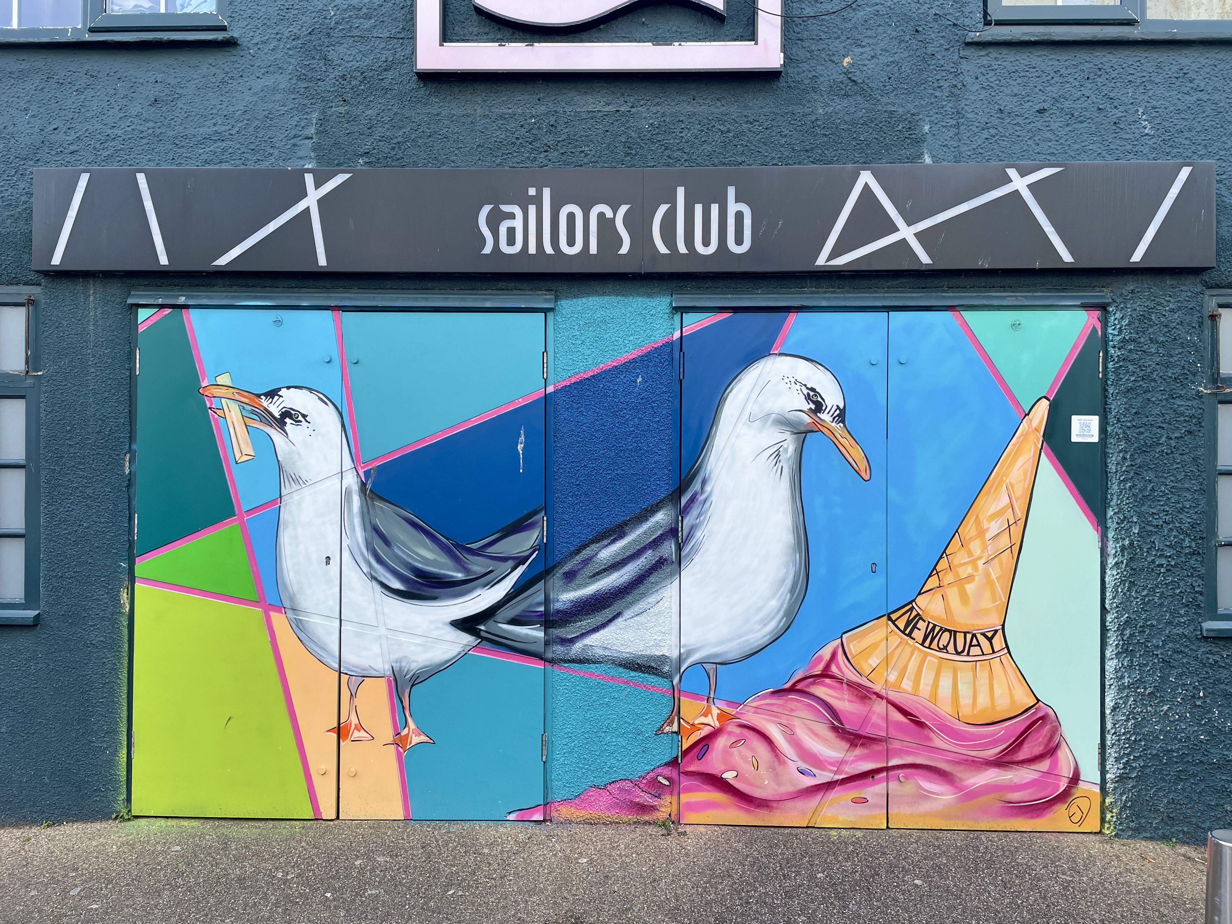 Colourful Bloody Gulls mural by Emily Donald on the Sailors Club doors in Newquay