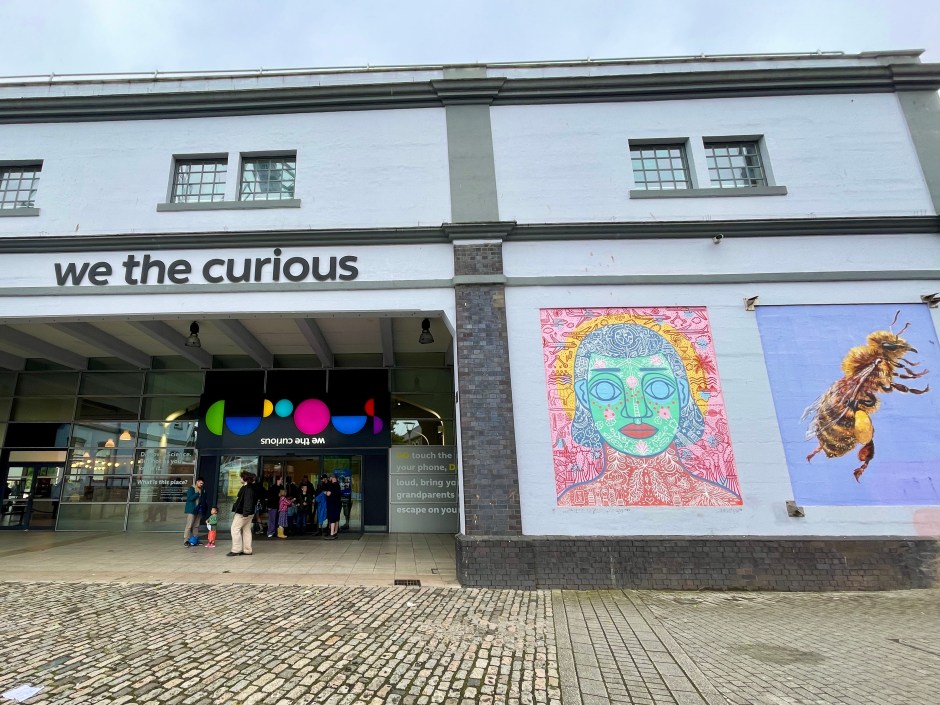 We The Curious Bristol entrance with colourful murals on the outside wall