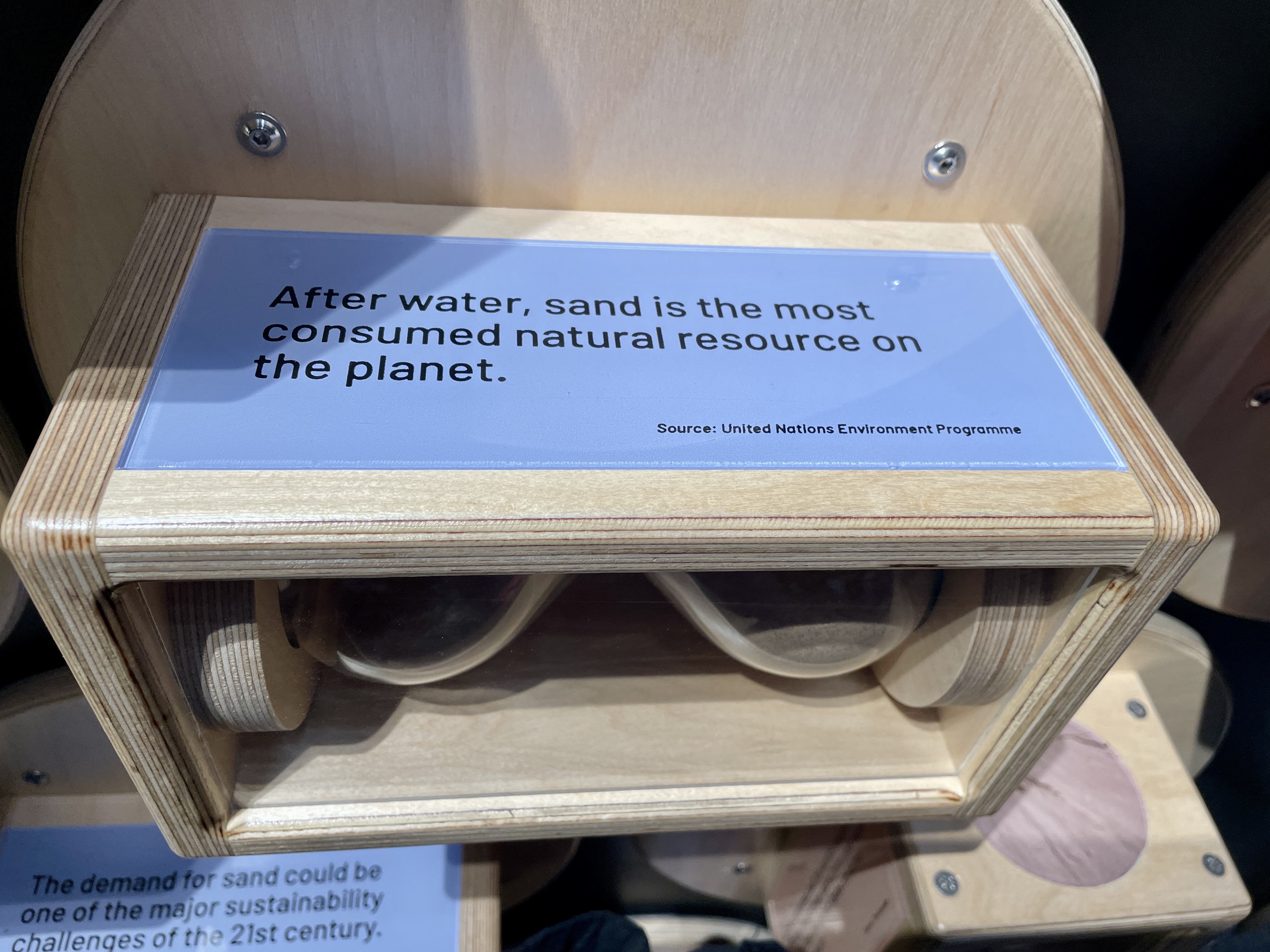 Sand exhibit display reading After water sand is the most consumed natural resource on the planet at We The Curious Bristol